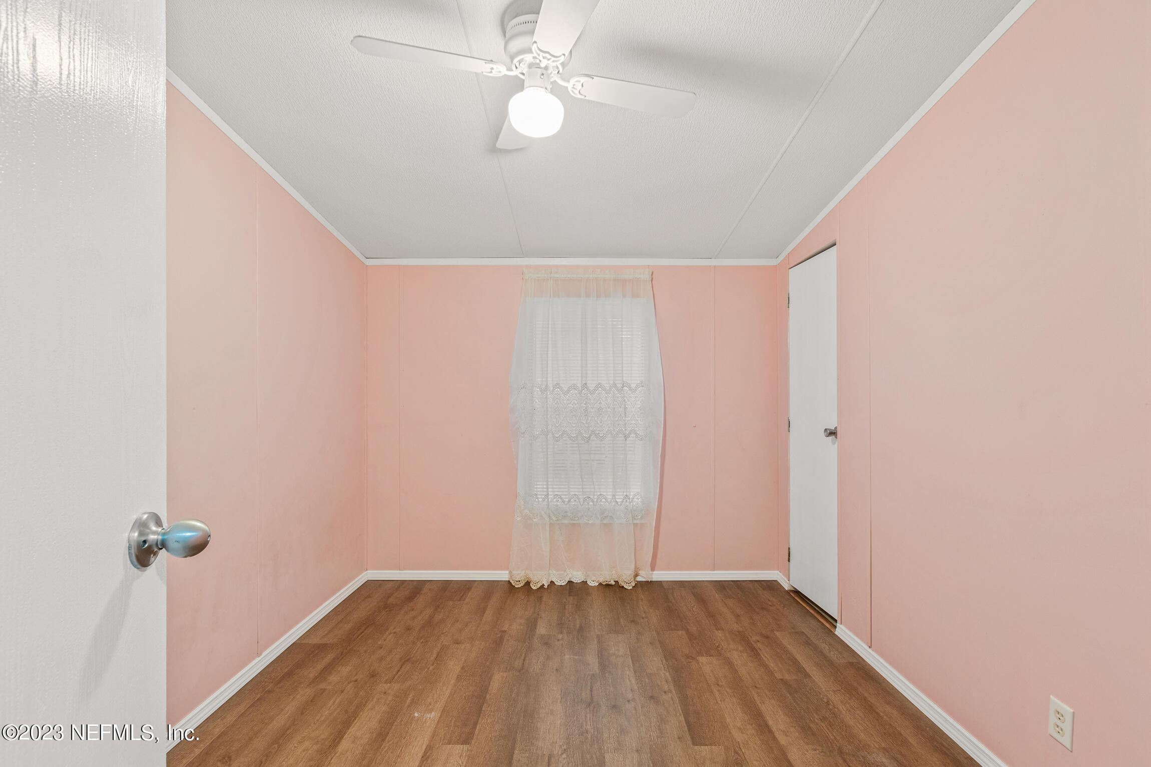 665 Lee Road Jacksonville, FL 32225 - Photo 46 of 58 a view of an empty room with wooden floor