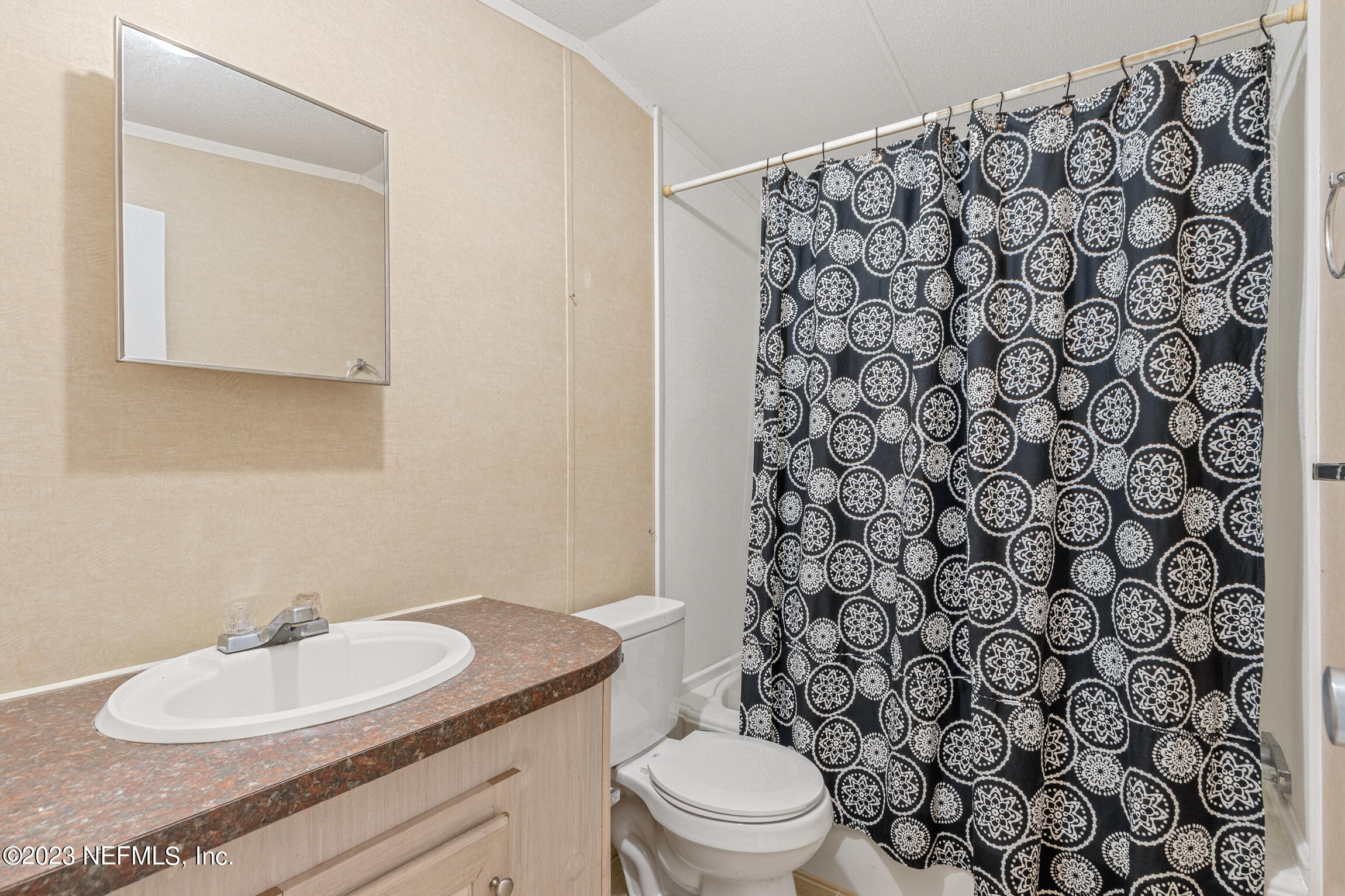 665 Lee Road Jacksonville, FL 32225 - Photo 48 of 58 a bathroom with a sink toilet and mirror