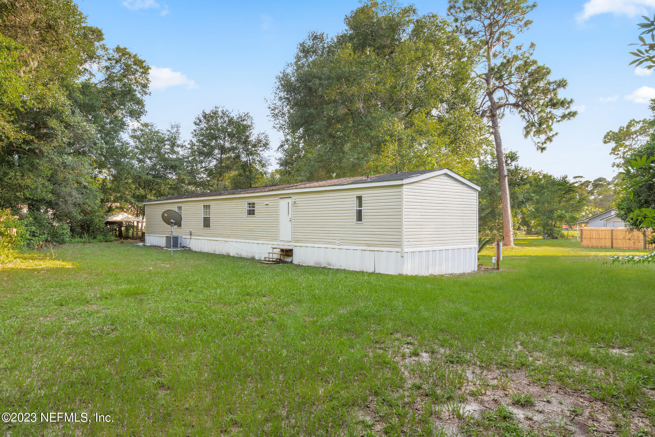 665 Lee Road Jacksonville, FL 32225 - Photo 49 of 58 a view of a house with backyard
