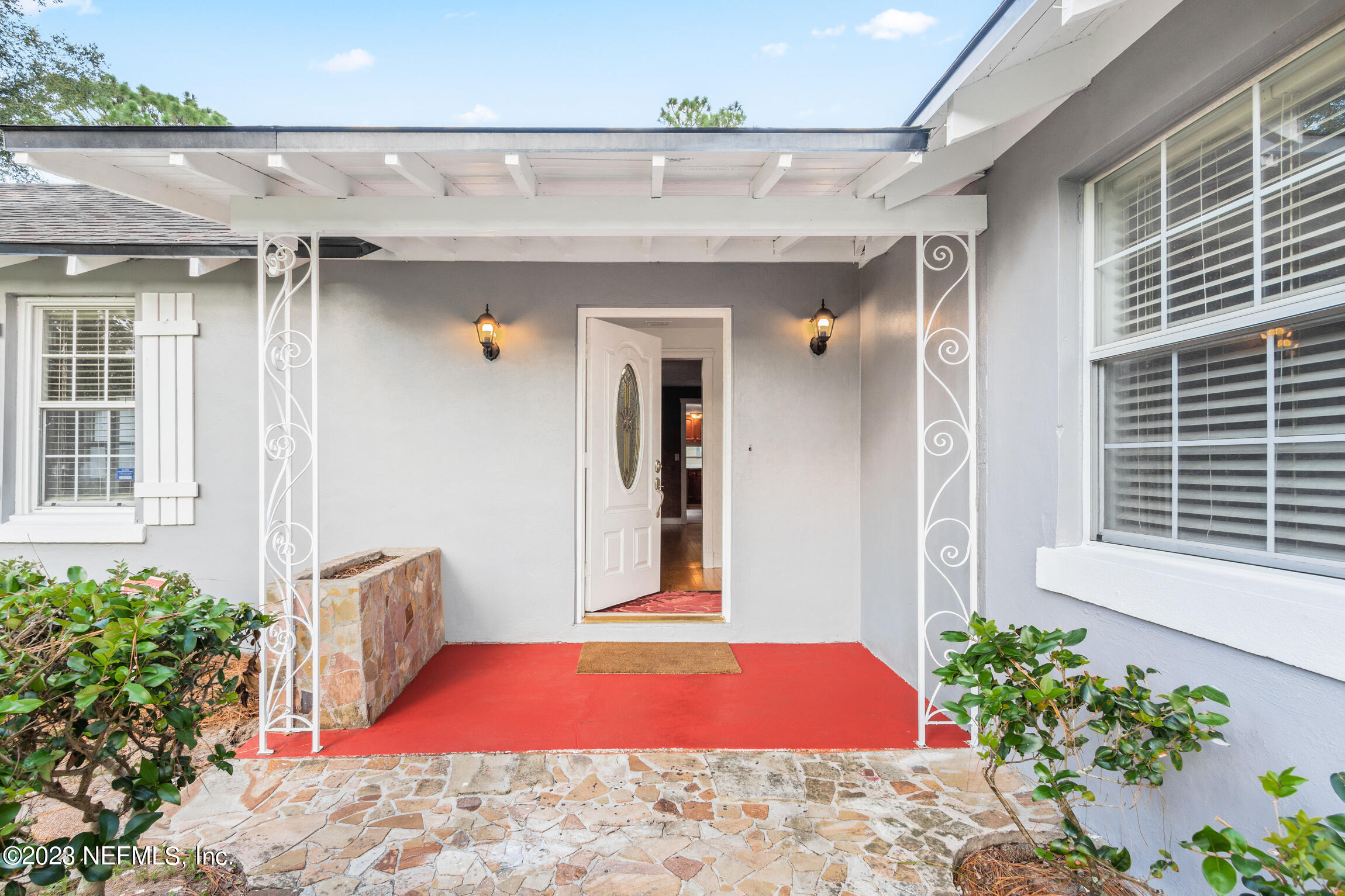 665 Lee Road Jacksonville, FL 32225 - Photo 5 of 58 a front view of a house with outdoor seating