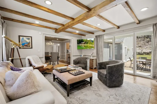 a living room with furniture and a book shelf