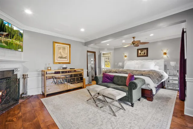 a bathroom with a granite countertop tub a sink and a large mirror