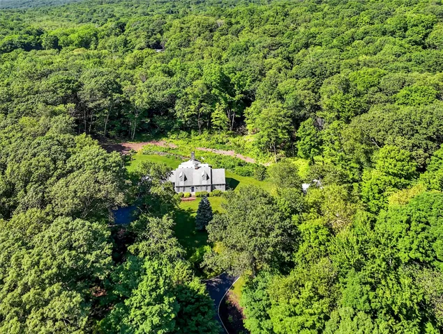 a backyard of a house with outdoor seating and green space