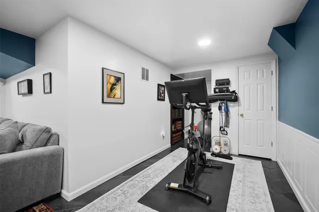 a view of a garage with a car parked in it