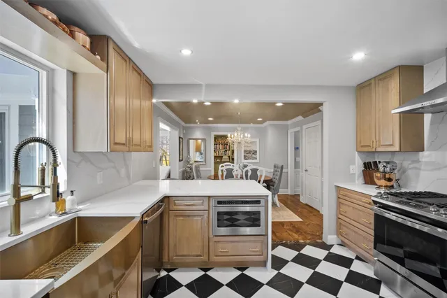 a kitchen with a sink stove and cabinets
