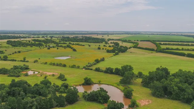 a view of a lake with houses in the background