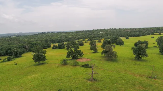 a view of a lake with a yard