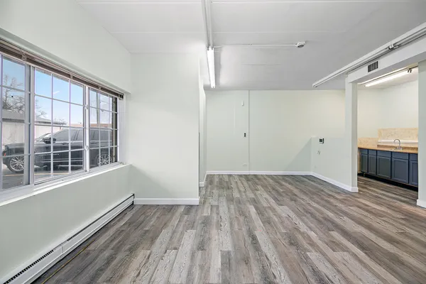 a view of a livingroom with wooden floor