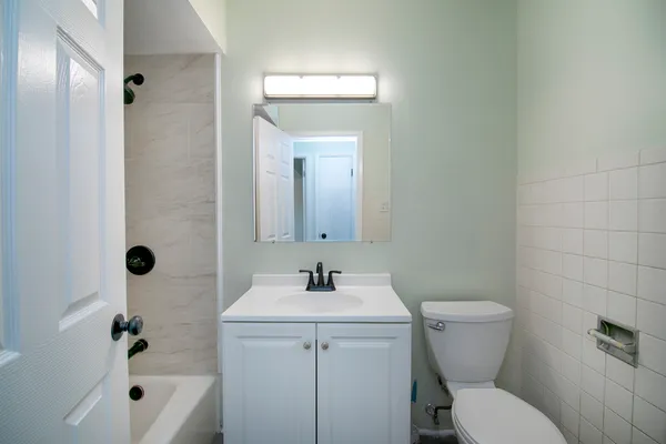 a room with lots of furniture and clutter