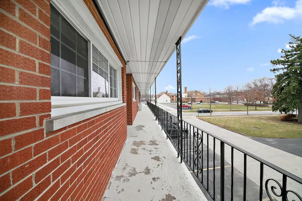 a view of wooden floor and windows in a room