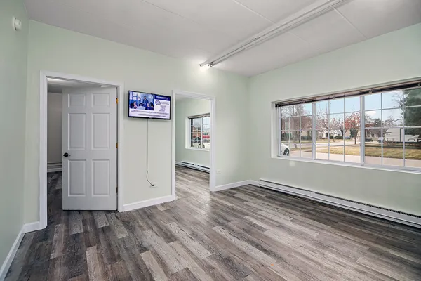wooden floor in an empty room and a window