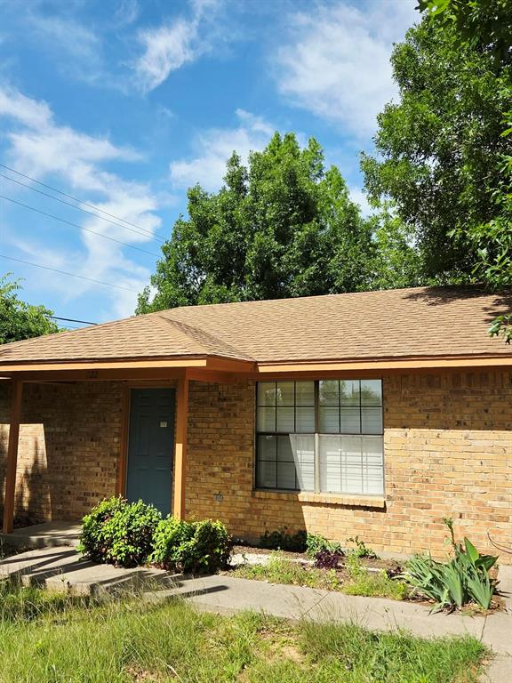 722 South Church Street Pilot Point, TX 76258 - Photo 5 of 37 front view of a house with a yard