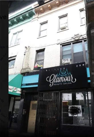 a front view of a building with sign board