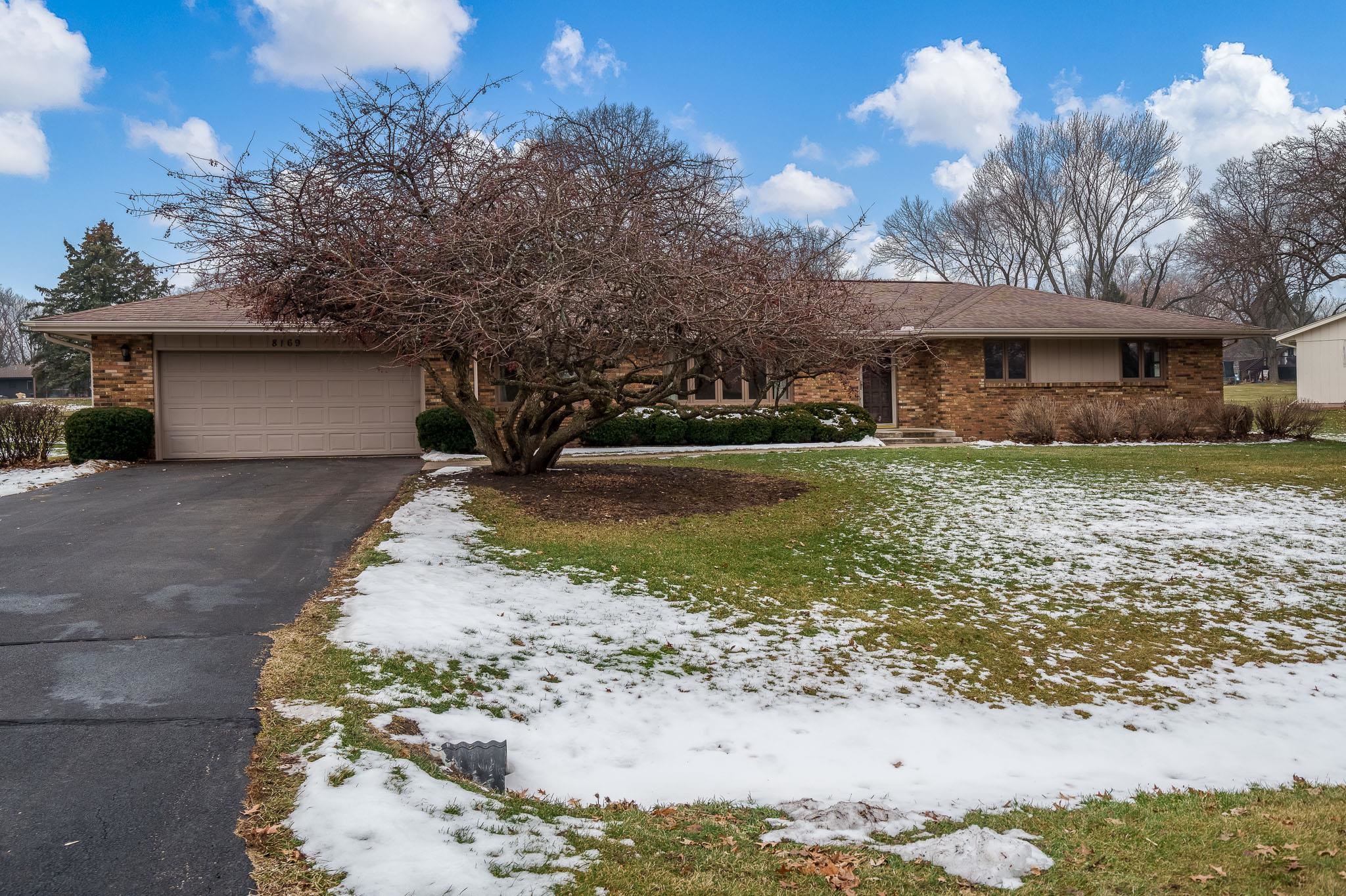 8169 Clockview Road Rockford, IL 61108 - Photo 1 of 34 a view of a house with a yard