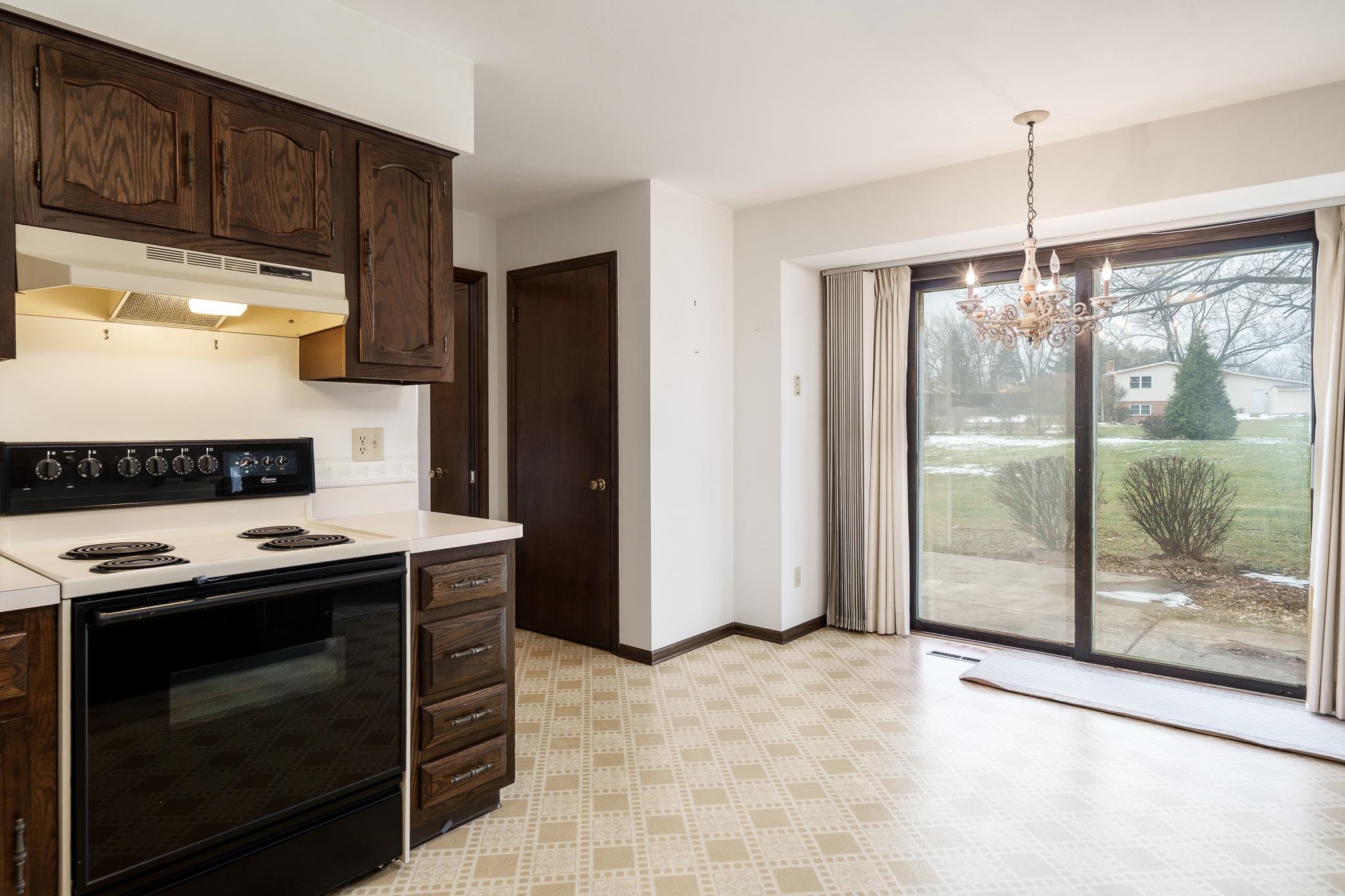 8169 Clockview Road Rockford, IL 61108 - Photo 11 of 34 a kitchen with a stove and a refrigerator