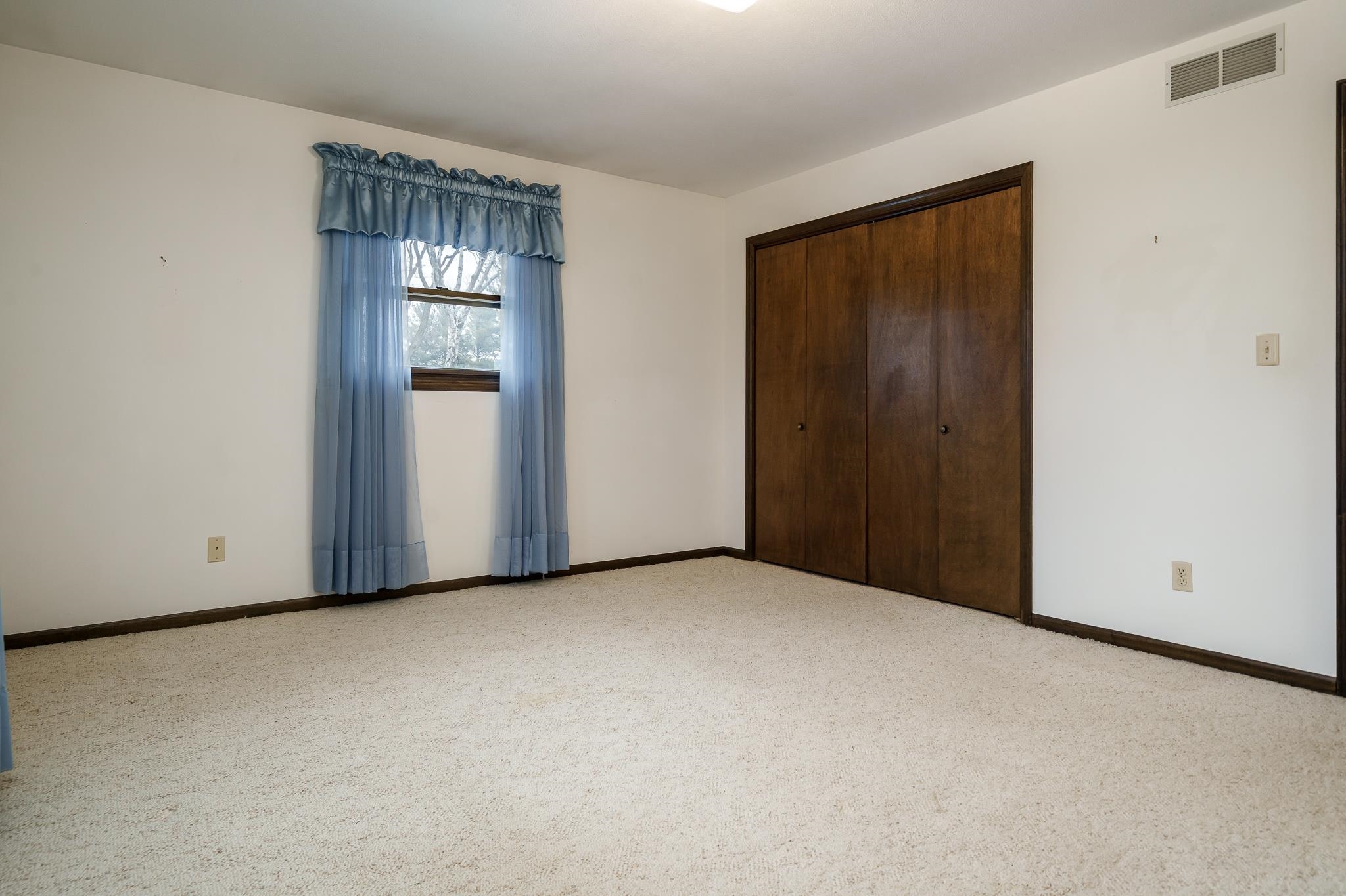 8169 Clockview Road Rockford, IL 61108 - Photo 22 of 34 a view of an empty room with a door