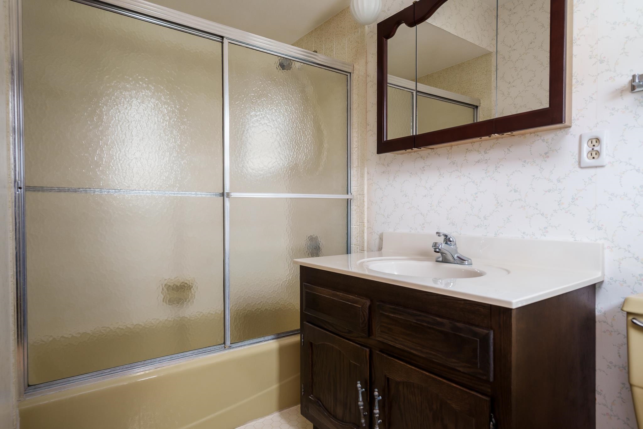 8169 Clockview Road Rockford, IL 61108 - Photo 25 of 34 a bathroom with a sink and a mirror