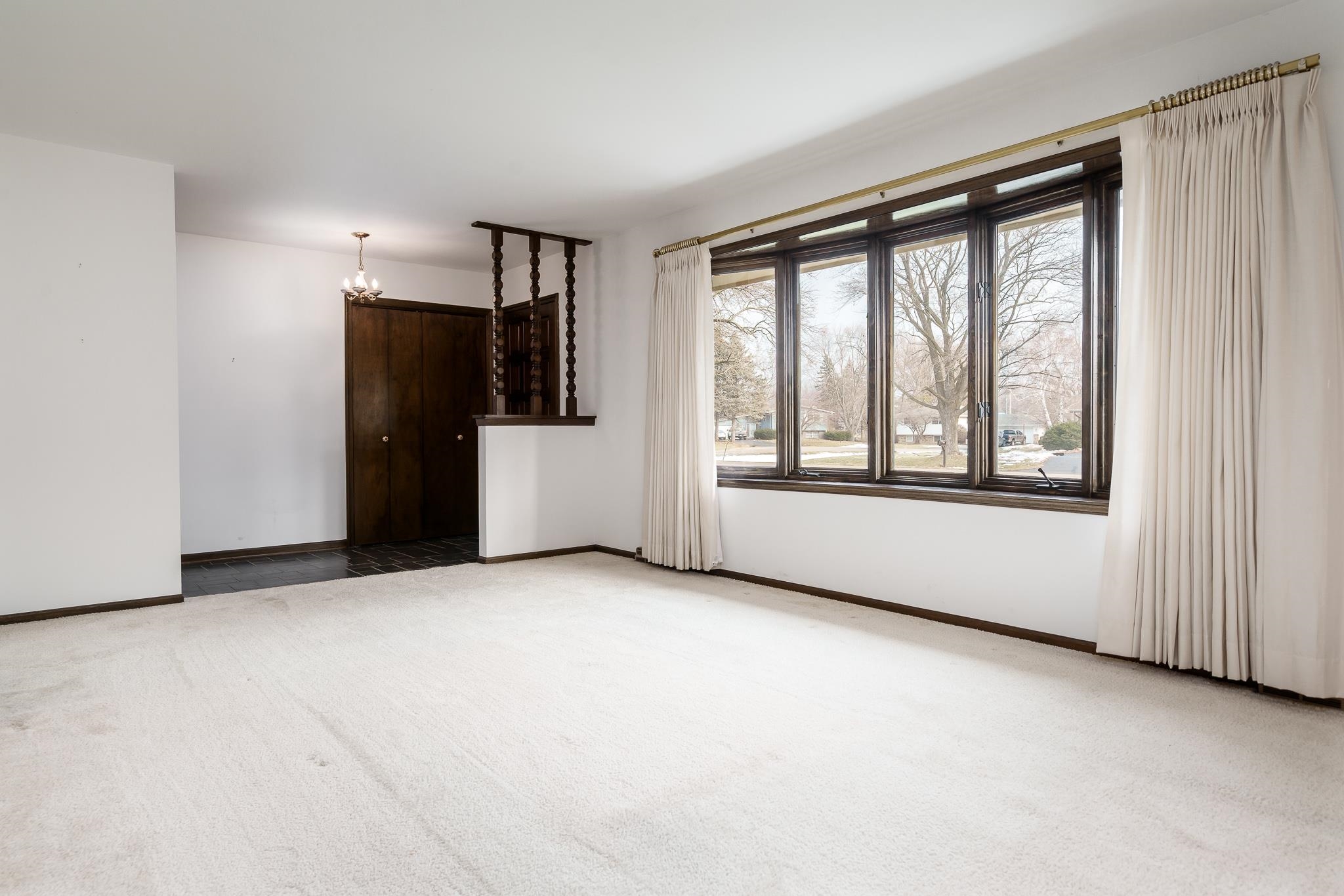 8169 Clockview Road Rockford, IL 61108 - Photo 5 of 34 a view of an empty room with a window