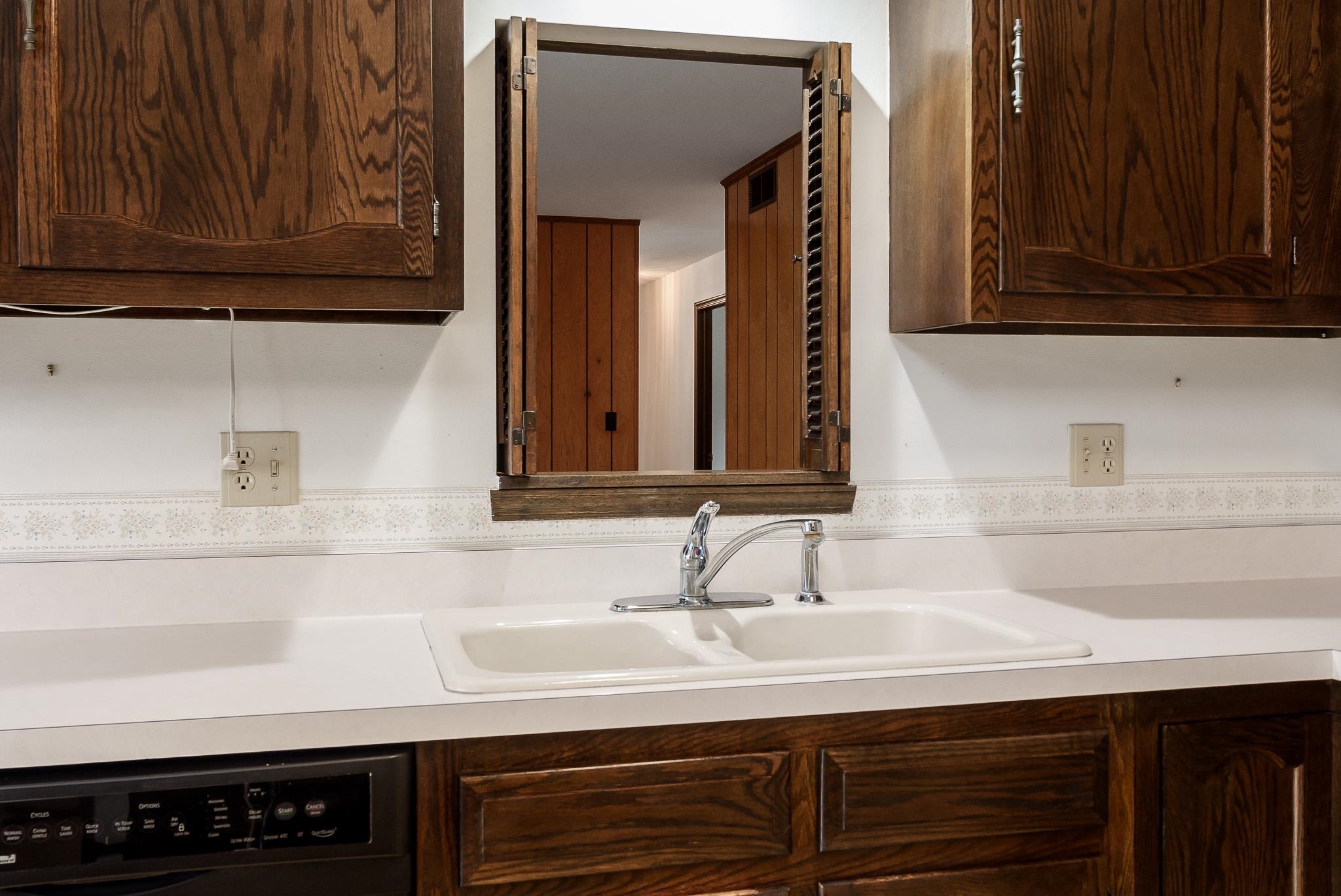 8169 Clockview Road Rockford, IL 61108 - Photo 10 of 34 a bathroom with a sink and a mirror