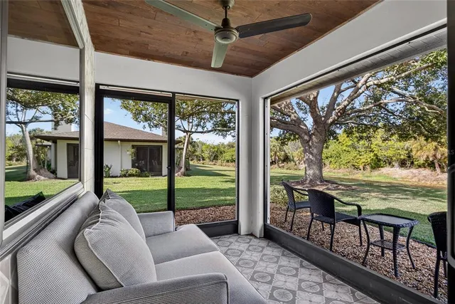 a balcony with furniture and a garden