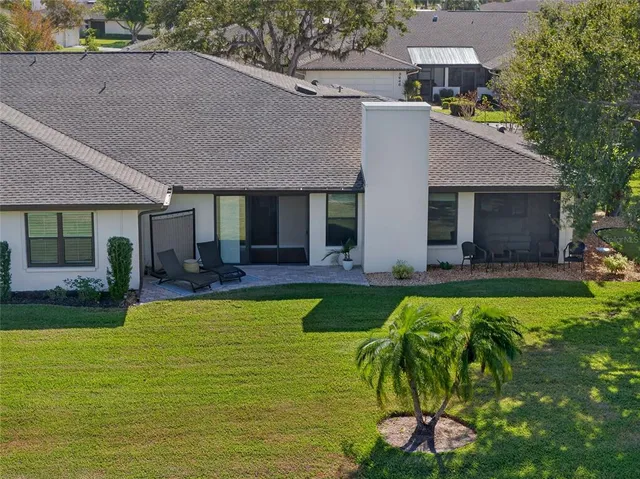 a view of house with swimming pool yard and outdoor seating