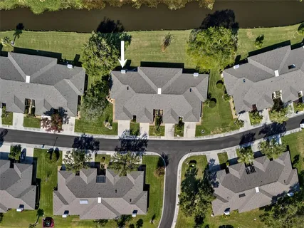 an aerial view of a house with outdoor space