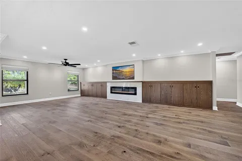 a view of a kitchen with a sink and a refrigerator