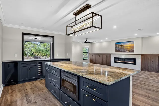 a kitchen with a stove a sink and a refrigerator