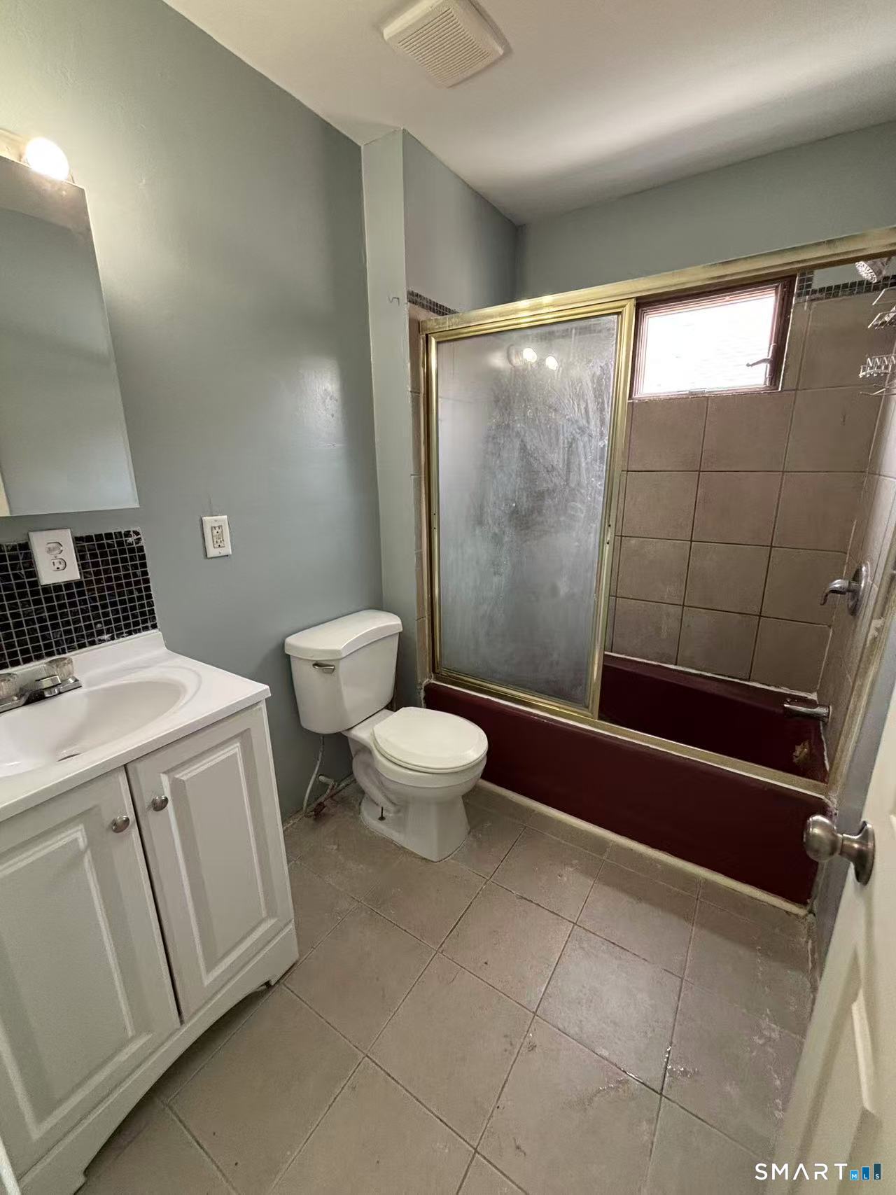 366 Dover Street Bridgeport, CT 06610 - Photo 12 of 15 a bathroom with a toilet a sink and shower