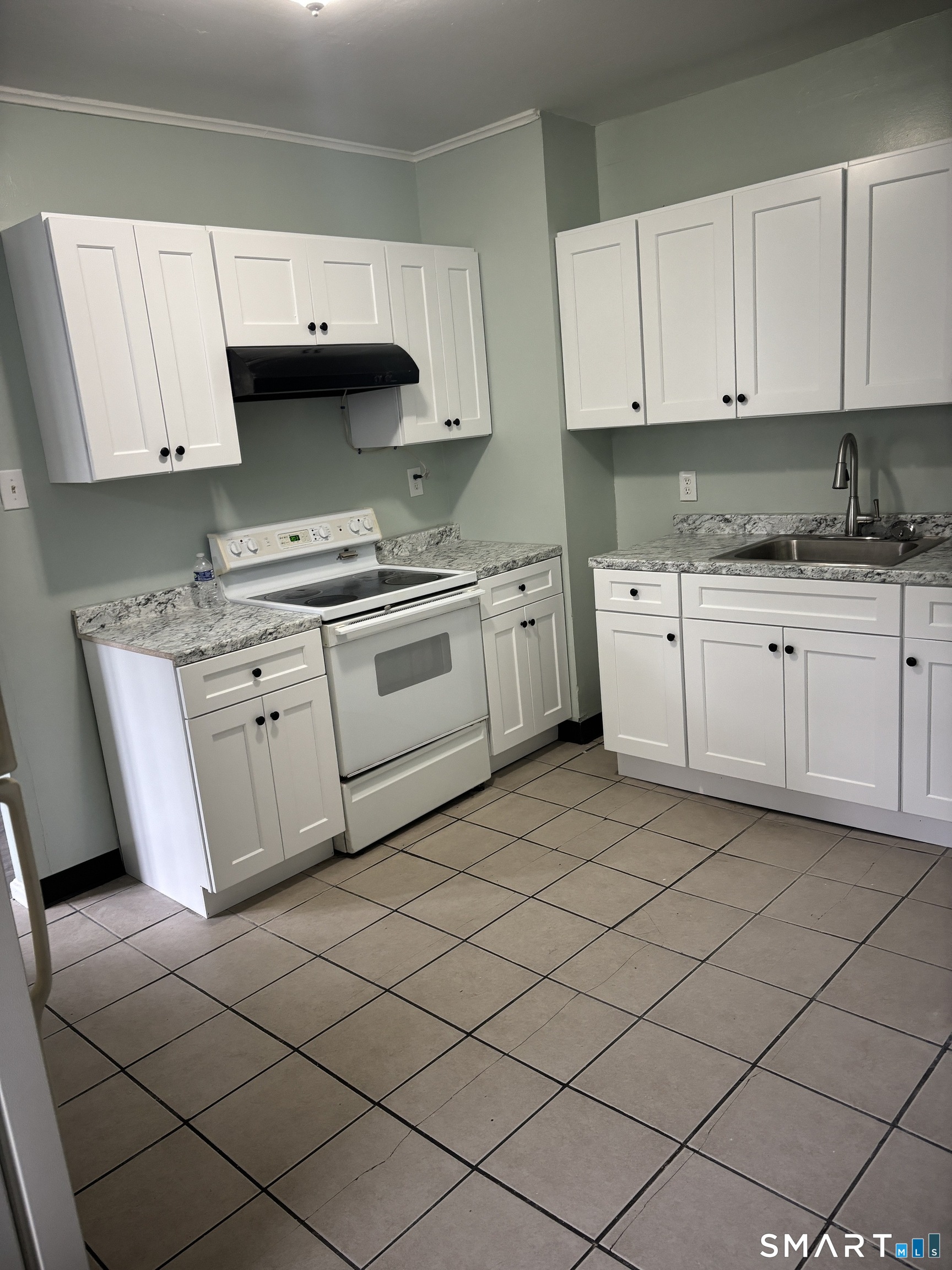 366 Dover Street Bridgeport, CT 06610 - Photo 13 of 15 a kitchen with granite countertop cabinets stainless steel appliances and a sink