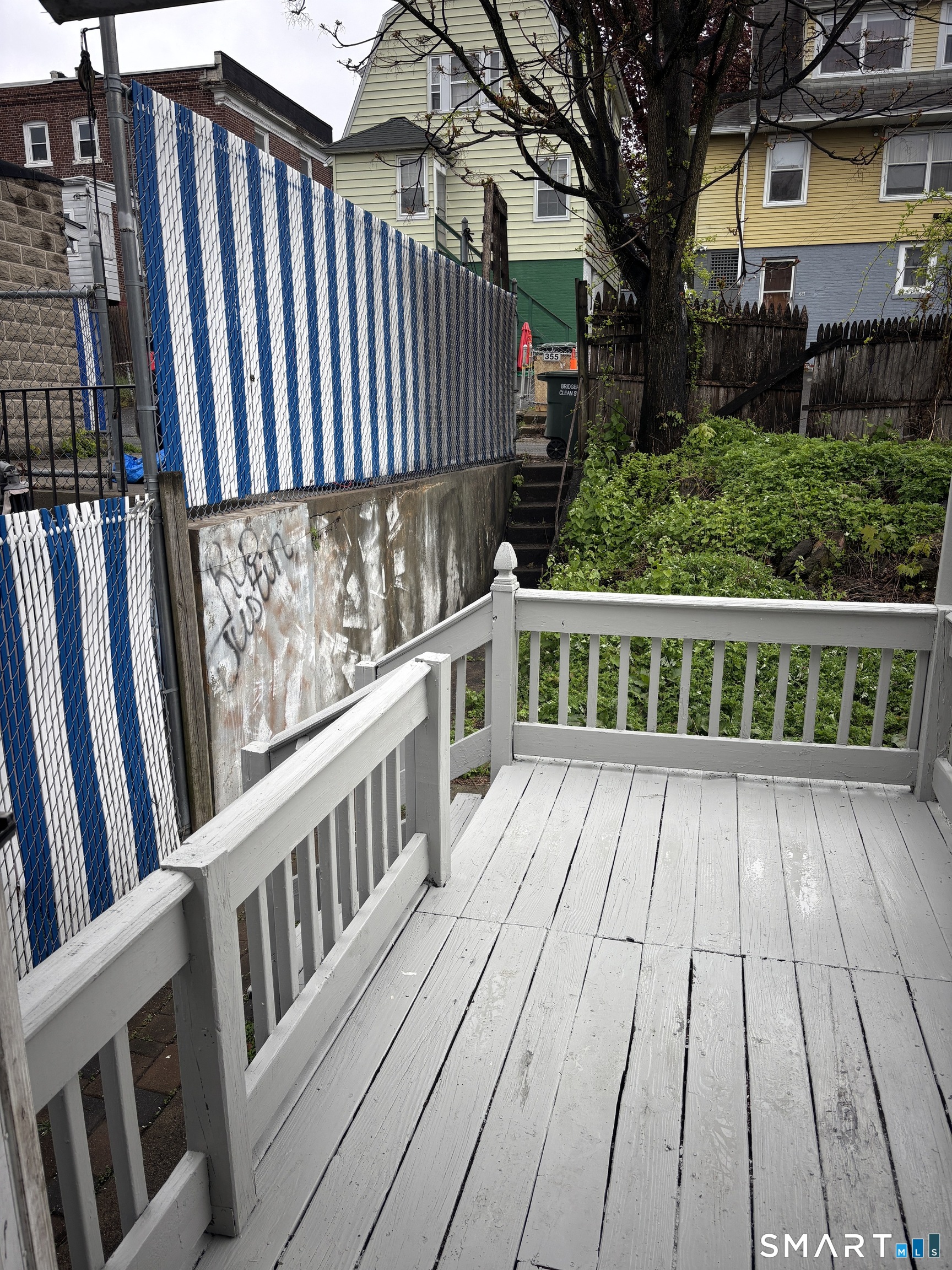 366 Dover Street Bridgeport, CT 06610 - Photo 15 of 15 a view of a wooden deck with a yard