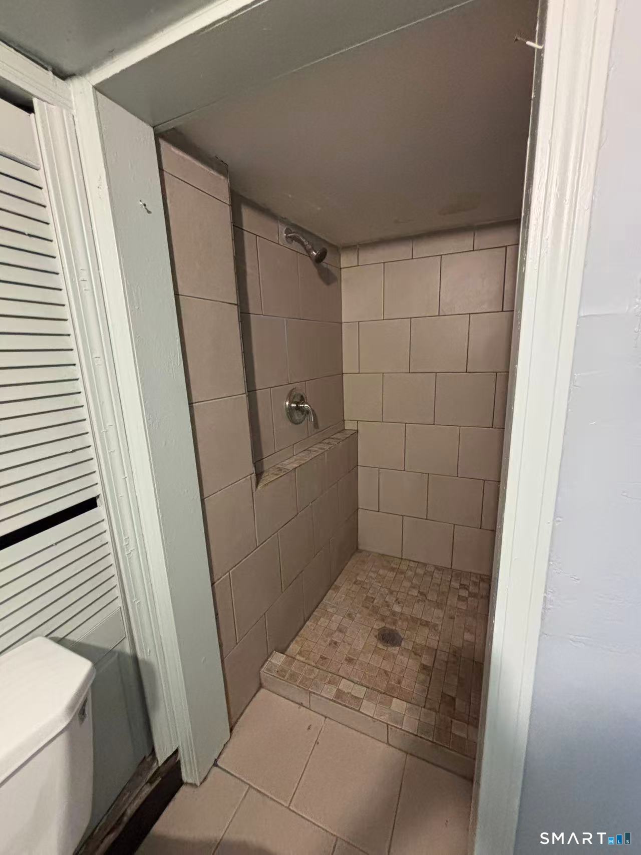 366 Dover Street Bridgeport, CT 06610 - Photo 10 of 15 a bathroom with a tub and shower