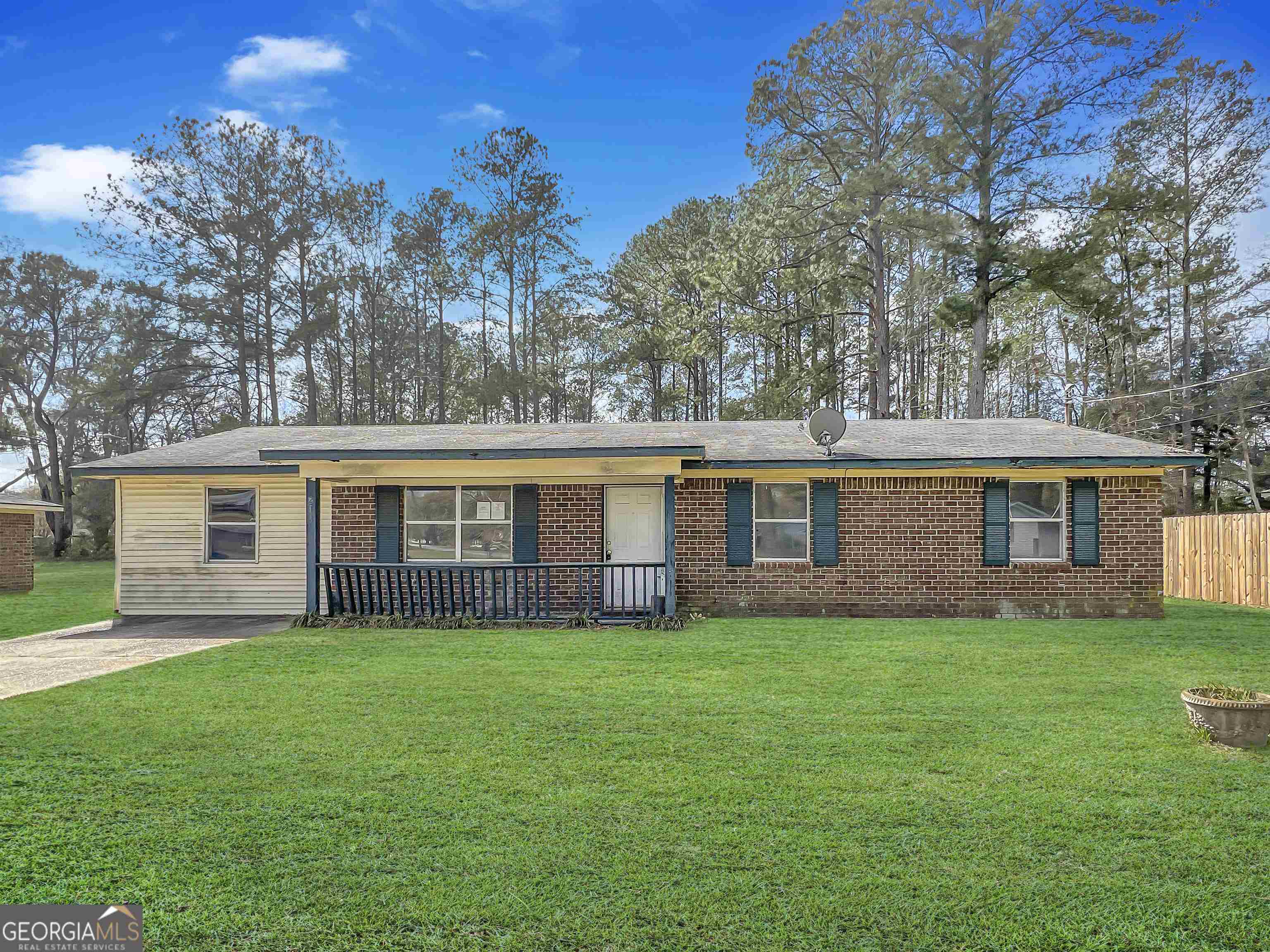 213 Middleground Road Rincon, GA 31326 - Photo 1 of 1 front view of a house that has a yard