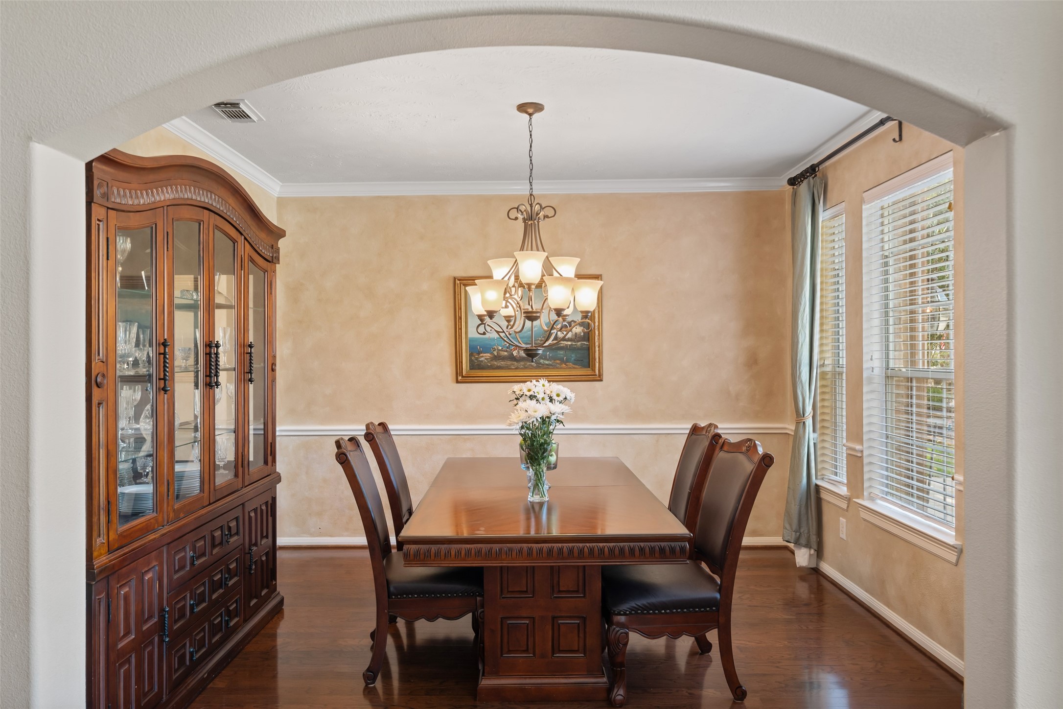 6407 Ashley Manor Drive Spring, TX 77389 - Photo 4 of 41 a dining room with furniture a chandelier and wooden floor