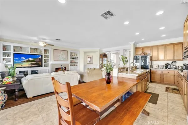 a kitchen with granite countertop cabinets stainless steel appliances and a counter space