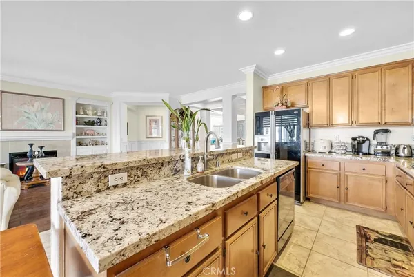 a bathroom with a granite countertop toilet sink and mirror