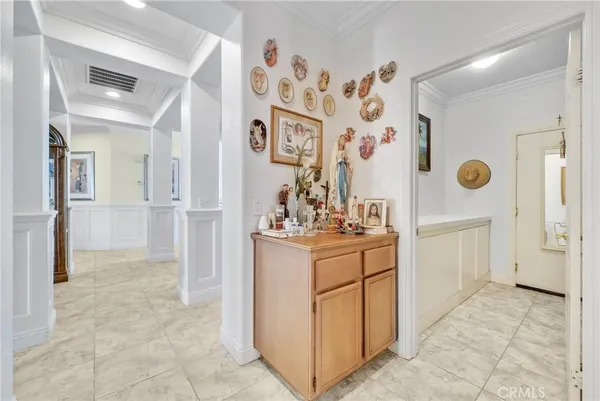 a bedroom with a bed gym equipment and view of living room