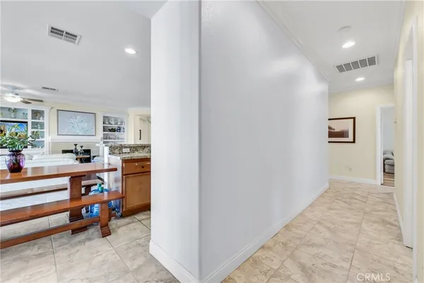a view of a patio with couches and potted plants