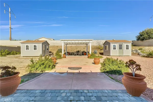 a view of a house with wooden fence