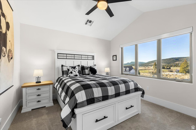 1210 East Bristle Cone Road Pine Valley, UT 84781 - Photo 25 of 54 Bedroom featuring a mountain view, a ceiling fan, and light-colored carpet