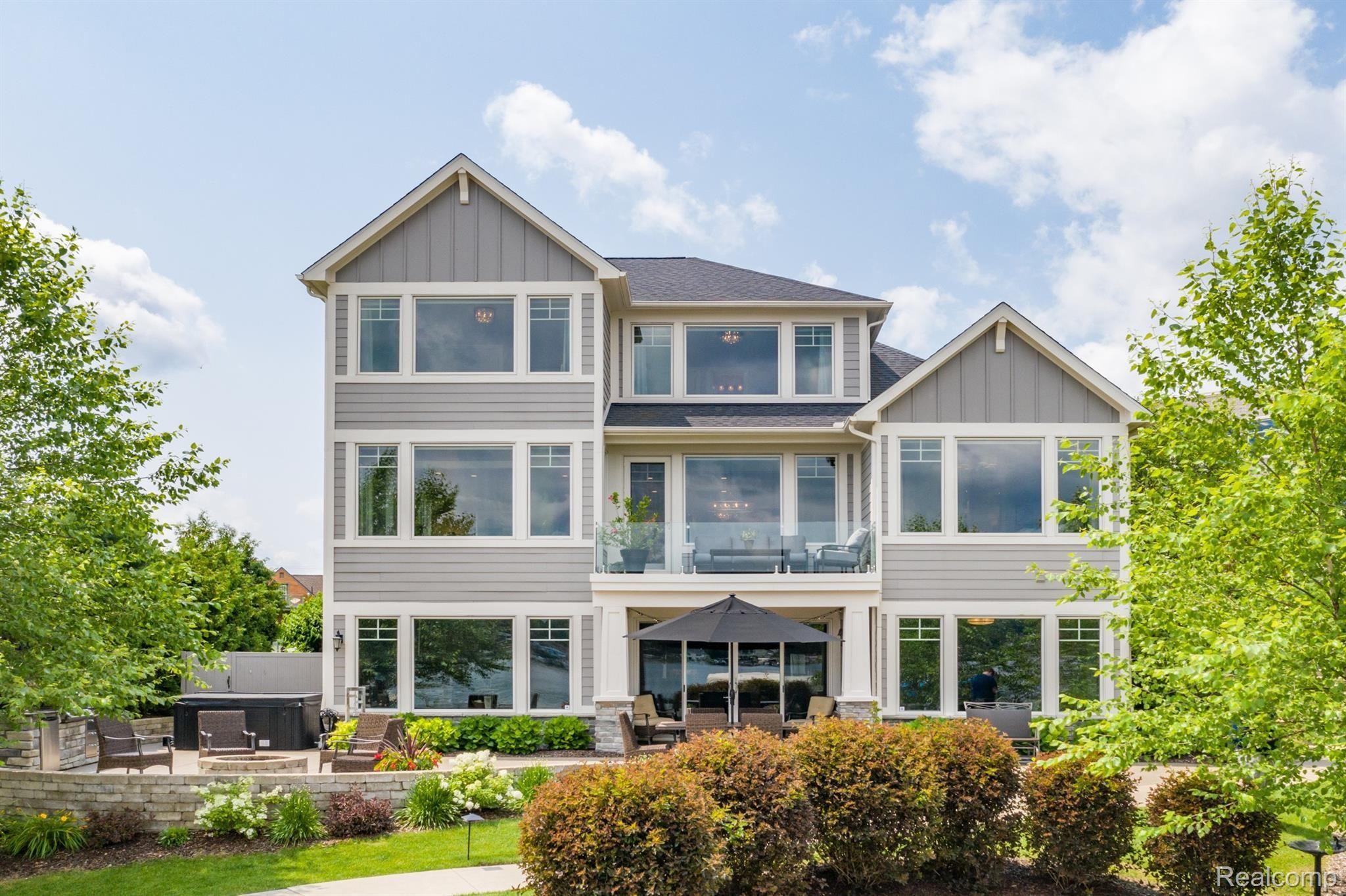 8309 Hilton Road Brighton, MI 48114 - Photo 2 of 56 Exceptional lake views require lots of windows!