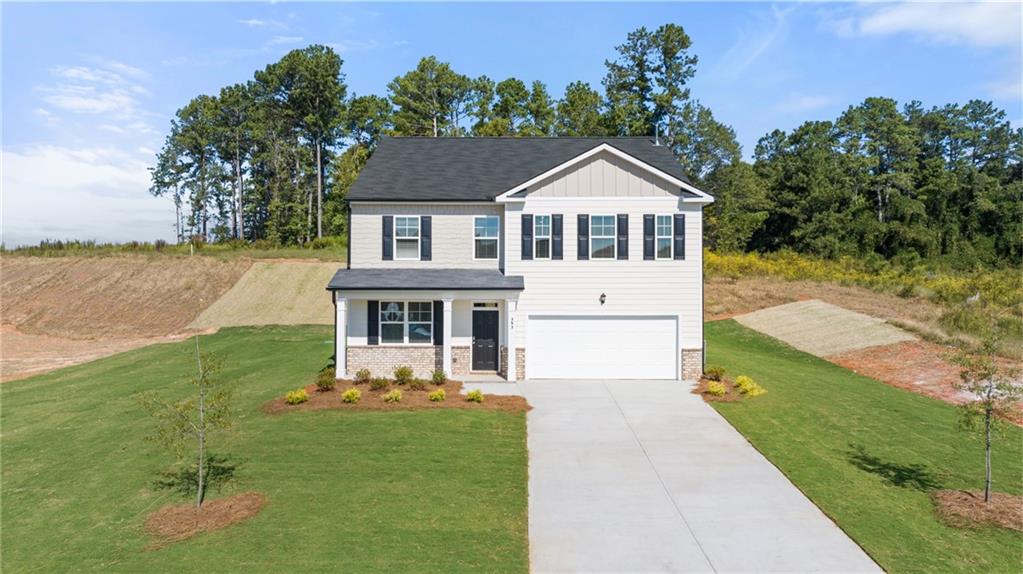 597 Ralph Still Road Dacula, GA 30019 - Photo 1 of 1 a front view of a house with garden