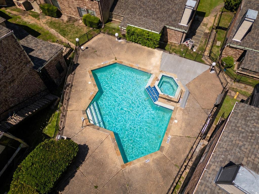 2835 Keller Springs Road, Unit 808 Carrollton, TX 75006 - Photo 2 of 16 Geometric pool and spa with concrete surround