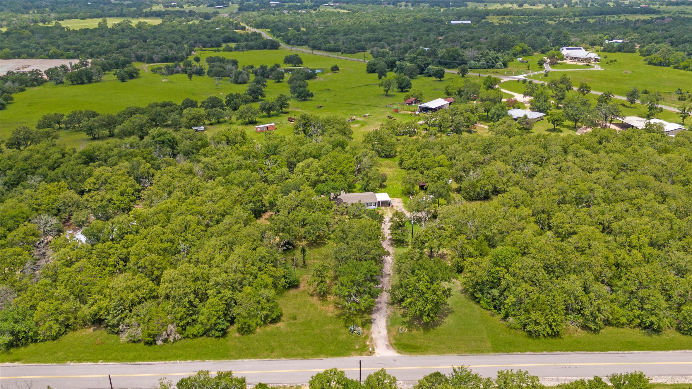 5845 Thousand Oaks Road College Station, TX 77845 - Photo 2 of 13 a view of a lake with houses
