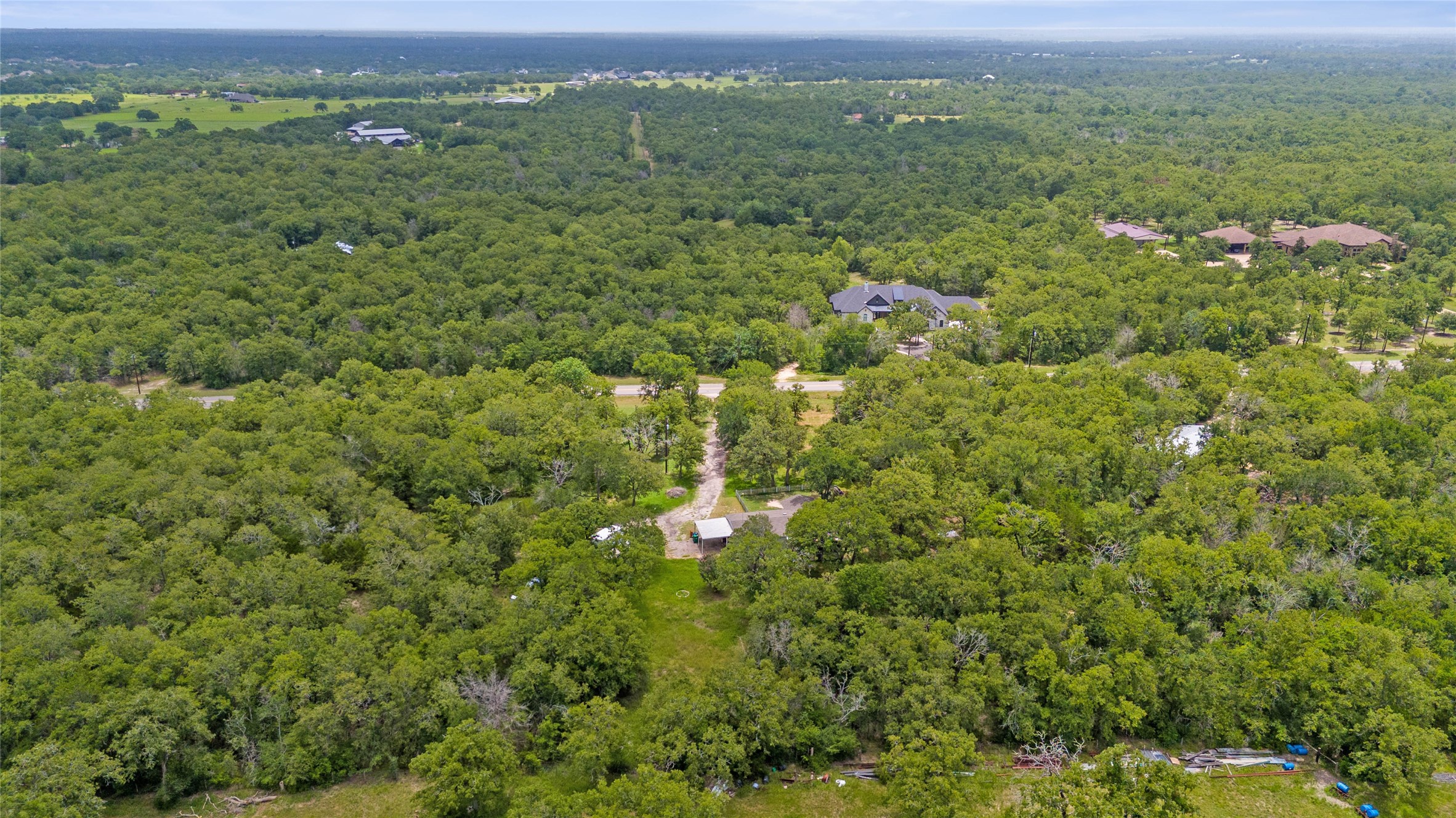 5845 Thousand Oaks Road College Station, TX 77845 - Photo 6 of 13 a view of a city with lush green forest