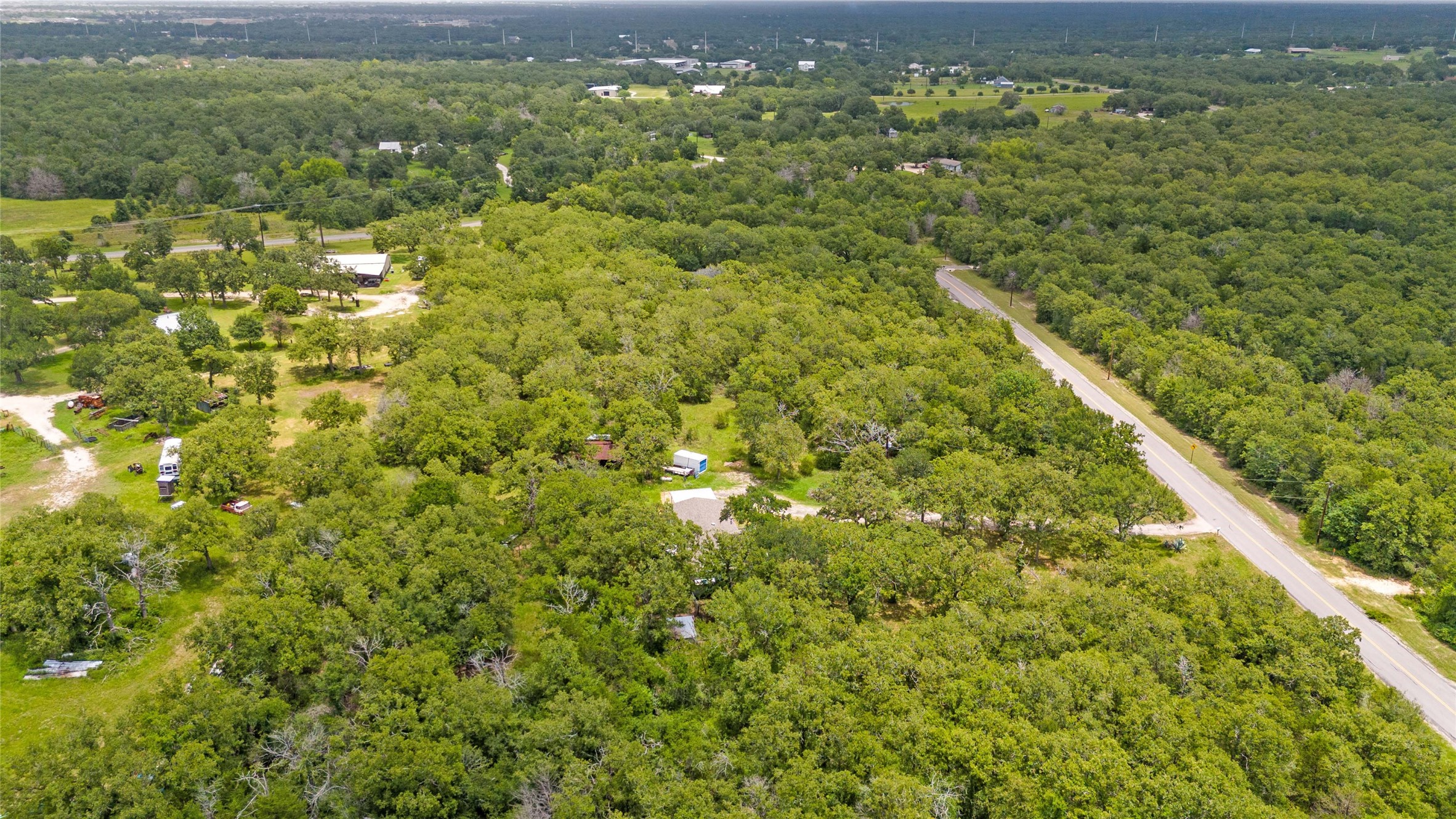5845 Thousand Oaks Road College Station, TX 77845 - Photo 9 of 13 a view of a green field with lots of bushes