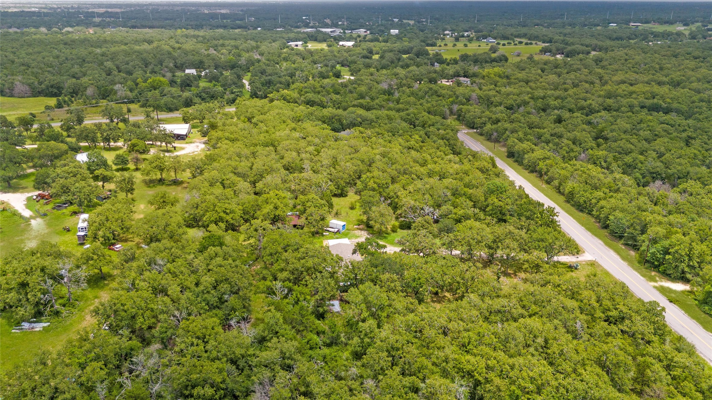 5845 Thousand Oaks Road College Station, TX 77845 - Photo 10 of 13 a view of a green field with lots of bushes