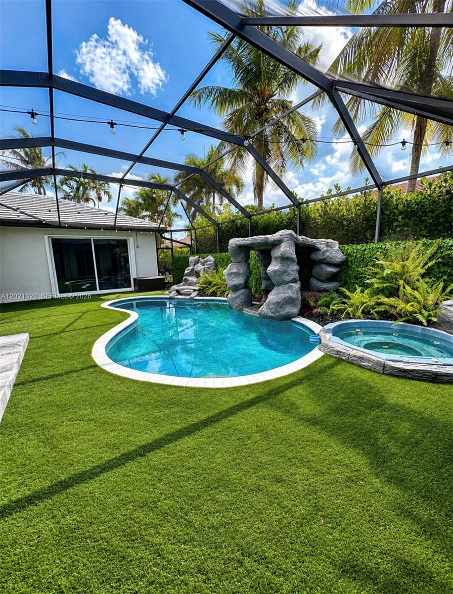 354 Mallard Road, Unit O Weston, FL 33327 - Photo 24 of 29 a view of a swimming pool with a patio