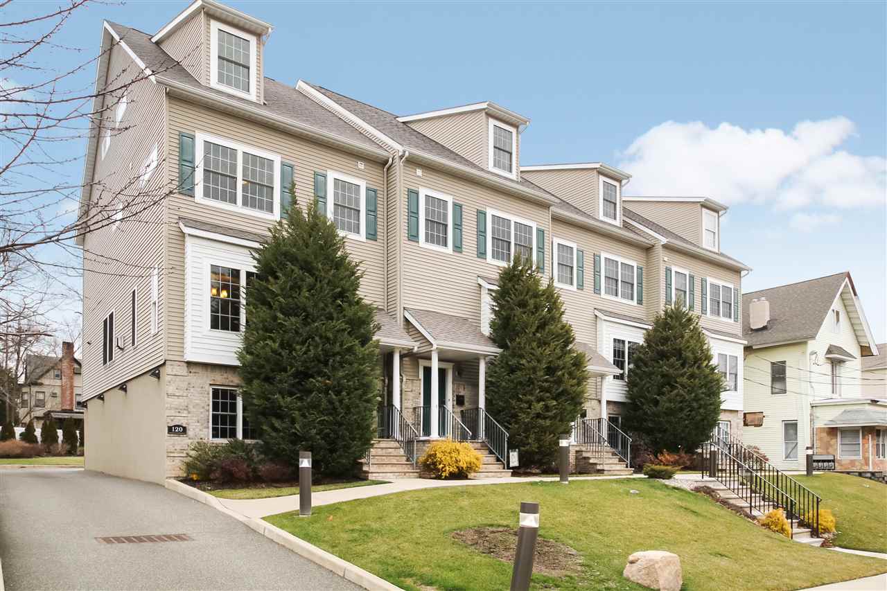 120 Chestnut Street, Unit D Rutherford, NJ 07070 - Photo 1 of 1 a view of a white house with yard in front of it