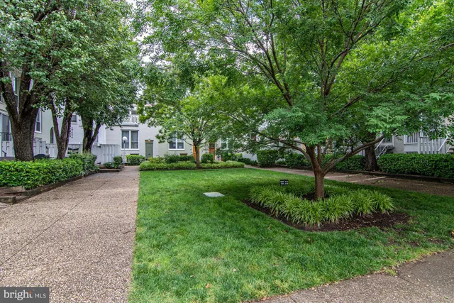 a view of a car parked in front of a house